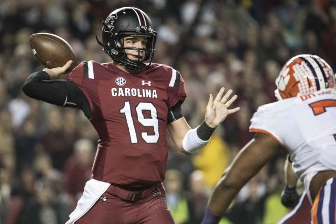 South Carolina quarterback Jake Bentley (19) attempts a pass against Clemson during a Nov. 25, 2017 game in Columbia, S.C. [SEAN RAYFORD/AP FILE PHOTO]