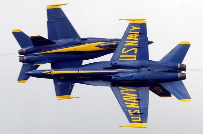 Two Blue Angels cross paths at the Cherry Point Air Show in 2012. [KEN BUDAY/GATEHOUSE MEDIA]