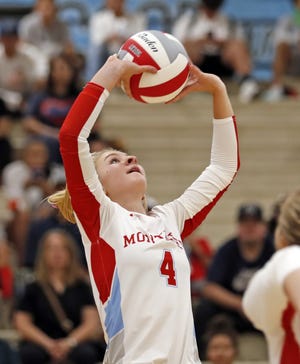 Monterey's Taylor Salsky (4) sets the ball during a nondistrict match Tuesday against Odessa High at Monterey High School. [Brad Tollefson/A-J Media]