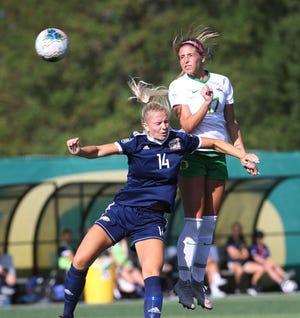 Oregon's Zoe Hasenauer (right) heads the ball toward the goal during an exhibition match against British Columbia last week. [Chris Pietsch/The Register-Guard] - registerguard.com