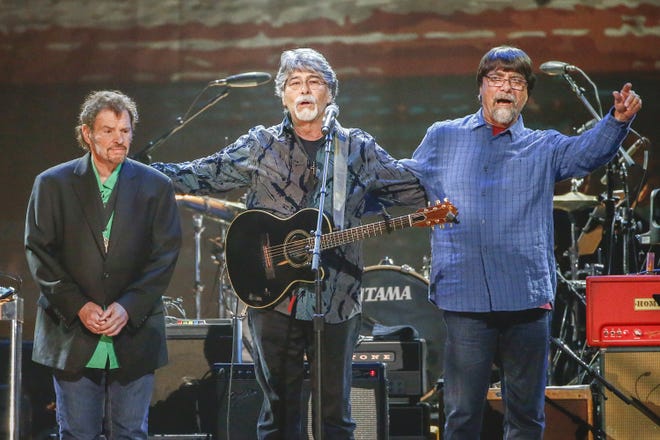 From left, Jeff Cook, Randy Owen and Teddy Gentry of the Southern rock band Alabama perform at the Bridgestone Arena in Nashville, Tenn., April 6, 2017. The band says it is postponing the remainder of its 50th anniversary tour as lead singer Owen battles health complications. [Photo by Al Wagner/Invision/AP, File]