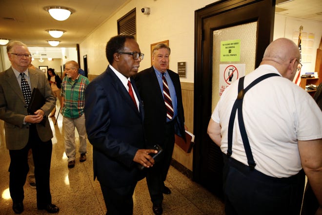 Nelson Linder, center, head of the local NAACP, wins a suit over the ballot language for Proposition B, the petition-initiated ordinance that could reallocate millions in hotel tax money from the Austin Convention Center. [RALPH BARRERA / AMERICAN-STATESMAN]