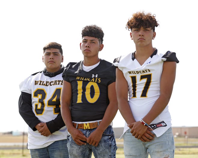 From left to right: Brothers Roel, Robert and Ramsey Vicencio play together on the Wellman-Union football team. Prior to, the brothers were seperated before coming together on the same squad. [Brad Tollefson/A-J Media]