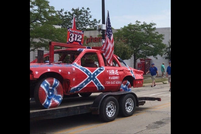 A demolition derby car with a Confederate flag painted on it was entered in the Monroe County Fair parade. Members of the Monroe County Positive Action Network, a local citizens' group, have expressed disapproval for the entry. [Monroe News photo by PAULA WETHINGTON]