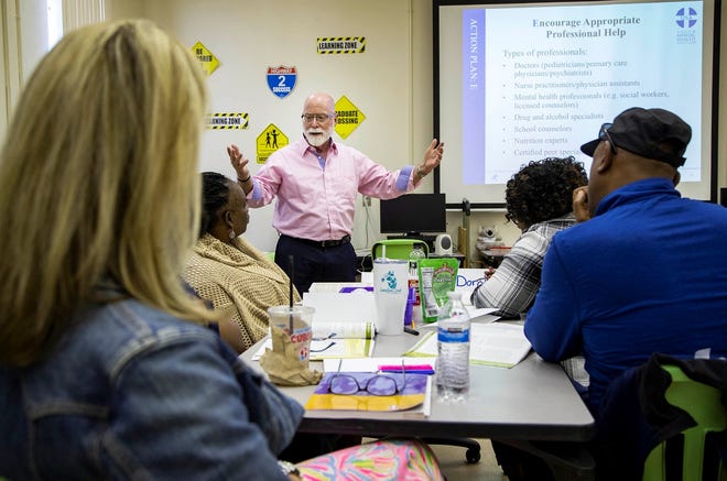 Rick Lewis teaches mental health first aid to school staff. The next step is for schools to teach students about mental health. [ALLEN EYESTONE/palmbeachpost.com]