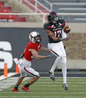 Texas Tech cornerback John Davis (17) goes up to intercept a pass intended for Dalton Rigdon during a 2018 spring scrimmage. Davis has gained more than 15 pounds since he first arrived at Tech and is in the mix to play this year as a sophomore. [Brad Tollefson/A-J Media]