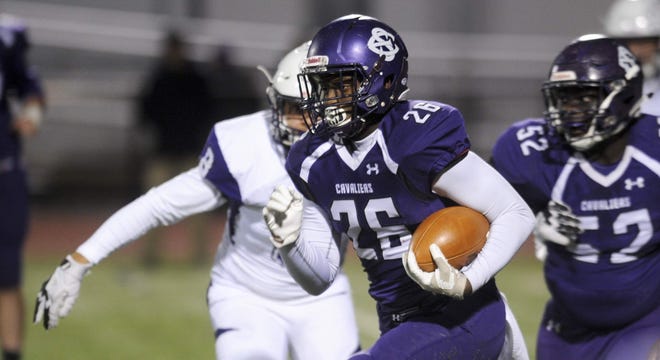 East Stroudsburg South's Christian Arrington runs the ball up the middle as the Cavaliers face the Buckhorns of Wallenpaupack last season. [POCONO RECORD FILE PHOTO]