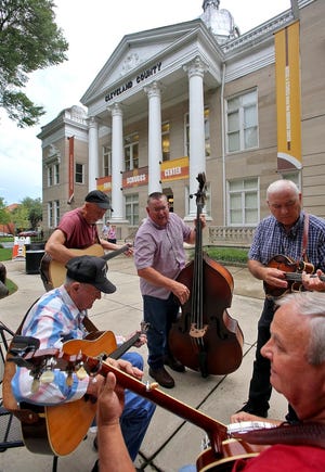 Musicians spend an afternoon performing music outside the Earl Scruggs Center. [Brittany Randolph/The Star]