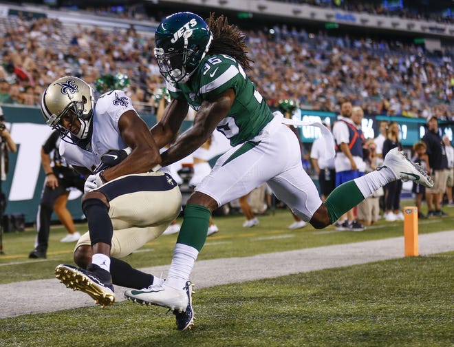 New Orleans receiver Michael Thomas catches a touchdown pass in front of Jets cornerback Tevaughn Campbell. [THE ASSOCIATED PRESS]