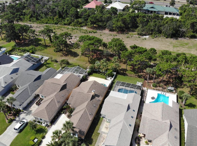 An aerial view shows homes in The Glades neighborhood on July 31, 2019. Community members have expressed concerns over planned developments for the area. [PATTI BLAKE/THE NEWS HERALD]