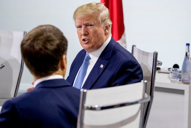 French President Emmanuel Macron, left, and President Donald Trump, right, participate in a G-7 Working Session on the Global Economy, Foreign Policy, and Security Affairs the G-7 summit in Biarritz, France, on Sunday.