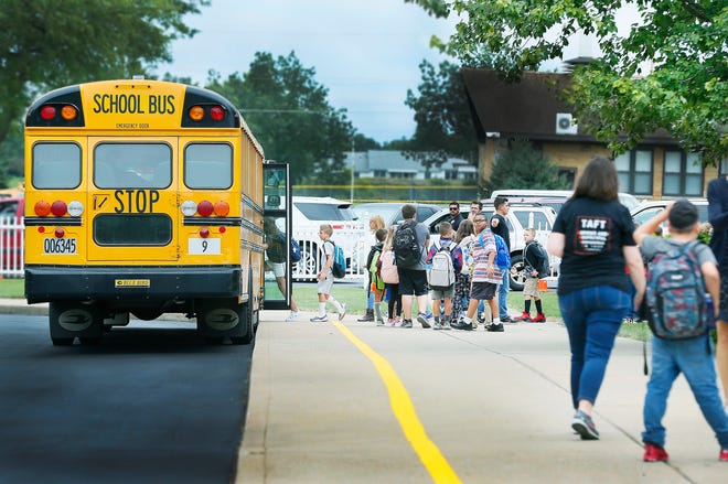 Students at Taft Intermediate School leave the building and board a bus after the first day of classes for Ashland City Schools on Monday. New London Local Schools and Ashland University also started classes Monday, while Black River and Loudonville will start Tuesday. The rest of the Ashland-area schools started last week.