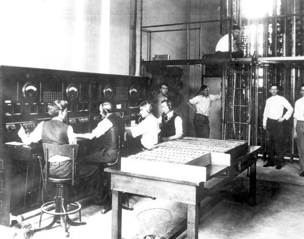 Men test a telephone switchboard in Jacksonville, Florida, in 1914. [State Archives of Florida]
