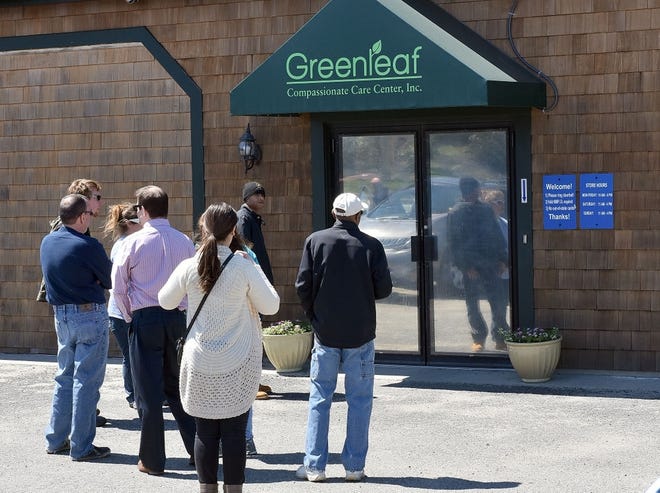 Greenleaf Compassionate Care Center customers wait to get into the Portsmouth facility in 2016. [DAILY NEWS FILE PHOTO]