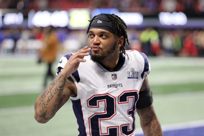 New England Patriots' Patrick Chung gestures before the start of Super Bowl LIII in Atlanta. Chung has been indicted in New Hampshire on a charge of cocaine possession. A Belknap County grand jury indicted the 32-year-old Chung on Aug. 8. Authorities said Chung knowingly possessed cocaine on June 25 while in Meredith, N.H.