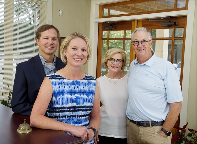 Beth and Mac Parrott (right) have retired and turned their Parrott Insurance business over to their daughter and son-in-law, Liz and Daniel Shive. [Donnie Roberts/The Dispatch]