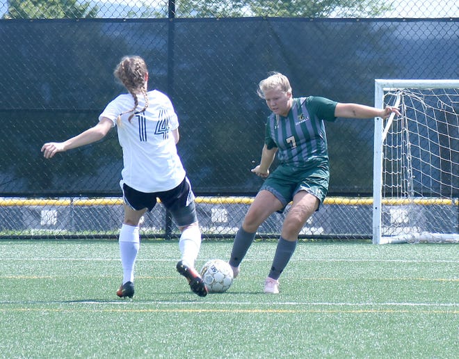 Sophomore Emile Swank (right) takes a shot Sunday for Herkimer College during the second half of a Coliseum Classic match against Holyoke Comnmunity College at Wehrum Stadium in Herkimer.      

[Jon Rathbun / Times Telegram]