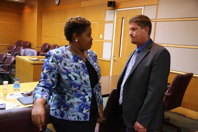 Defense attorney Theresa Jean-Pierre Coy and defendant Michael Drejka pause during a break in his manslaughter trial.