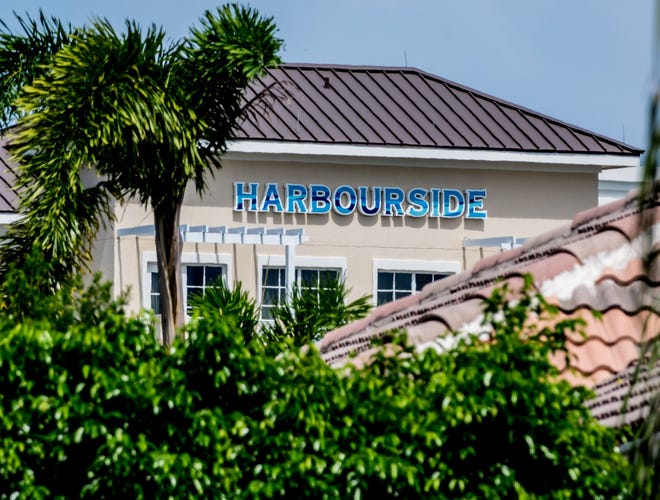 A view of Harbourside Place over rooftops in the Waters Edge Estates in Jupiter July 31, 2019.  [RICHARD GRAULICH/palmbeachpost.com]