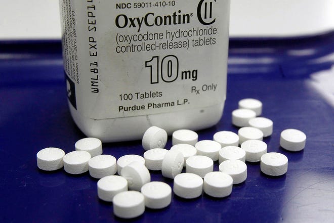This Feb. 19, 2013 file photo shows OxyContin pills arranged for a photo at a pharmacy in Montpelier, Vt. State attorneys general and lawyers representing local governments said Tuesday, Aug. 27, 2019, they are in active negotiations with Purdue Pharma, maker of the prescription painkiller OxyContin, as they attempt to reach a landmark settlement over the nation's opioid crisis. (AP Photo/Toby Talbot, File)