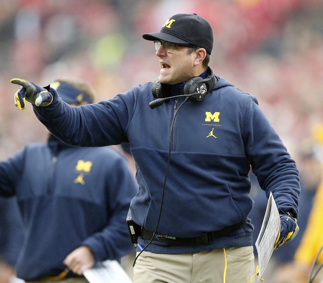 Jim Harbaugh coaches one of the Big Ten favorites in Michigan, but he also holds an 0-4 record against Ohio State. [Kyle Robertson/Dispatch]