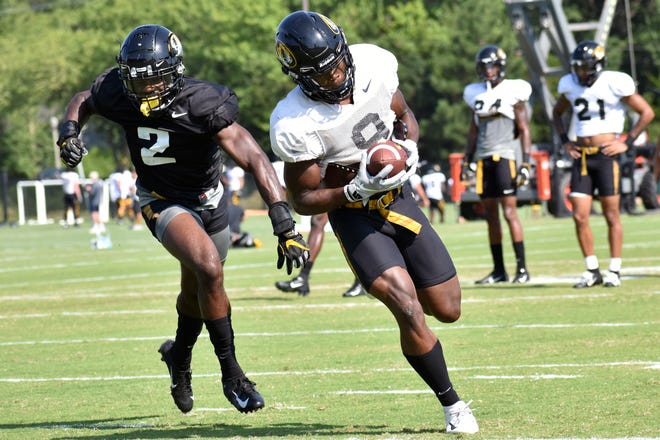 Missouri wide receiver Jalen Knox (9) accelerates after catching a pass while DeMarkus Acy (2) chases him during a team practice Aug. 5 at the Kadlec Practice Fields. [Eric Blum/Tribune]