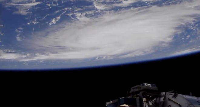 This Thursday, Aug. 29, 2019 image provided by NASA shows a view of Hurricane Dorian from the International Space Station as it churned over the Atlantic Ocean north of Puerto Rico. Leaving mercifully little damage in its wake in Puerto Rico and the Virgin Islands, Hurricane Dorian swirled toward the U.S., with forecasters warning it will draw energy from the warm, open waters as it closes in. (NASA via AP)