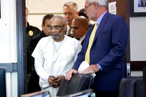 Abu-Ali Abdur'Rahman, front left, enters the courtroom for a hearing Wednesday, Aug. 28, 2019, in Nashville, Tenn. Abdur'Rahman, who was convicted of murder and is scheduled to be executed next April, claims that prosecutors' racially motivated dismissal of potential black jurors resulted in an unfair trial. (AP Photo/Mark Humphrey)