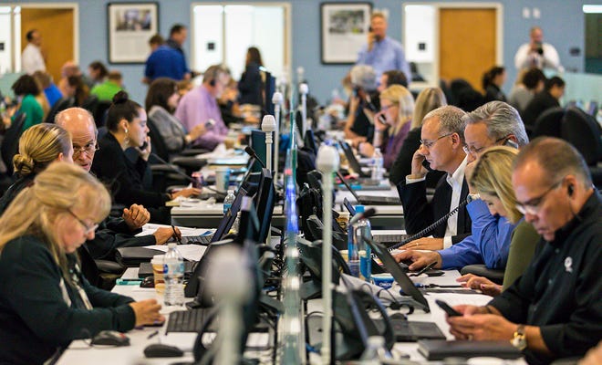FPL employees simulate their response to a hurricane during the company's annual storm drill in 2018. (Lannis Waters / The Palm Beach Post)
