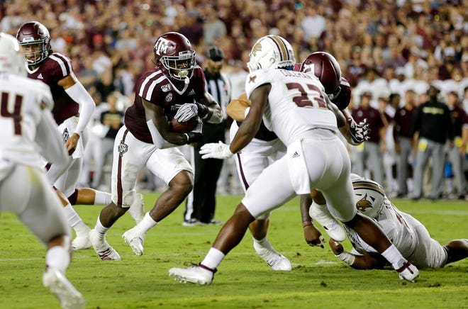 Texas A&M running back Jashaun Corbin (7) rushes for a touchdown against Texas State during the first half of an NCAA college football game, Thursday, Aug. 29, 2019, in College Station, Texas. (AP Photo/Sam Craft)