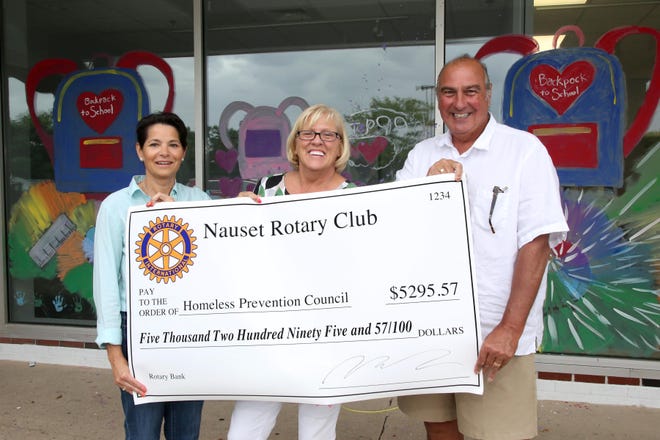 The Nauset Rotary Club recently presented a $5,000 check to the Homeless Prevention Council in support of the council's annual Backpack to School drive. Pictured from left are Nauset Rotary Club President Jennifer Whitaker, council case manager Maureen Linehan and council board president Richard Laraja.