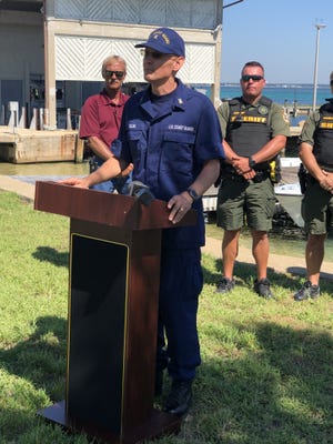 Master Chief Sean Sulski, officer in charge at Coast Guard Station Destin, speaks during a press conference Friday about Operation Safe Pass. The crackdown has cleared 30 illegal charter boat operators from Destin, Panama City and Orange Beach, Alabama. [DUWAYNE ESCOBEDO/DAILY NEWS]