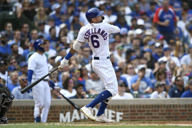 Chicago Cubs right fielder Nicholas Castellanos watches his two-run home run during the second inning against the Milwaukee Brewers on Friday, Aug 30, 2019, in Chicago. [PAUL BEATY/THE ASSOCIATED PRESS]
