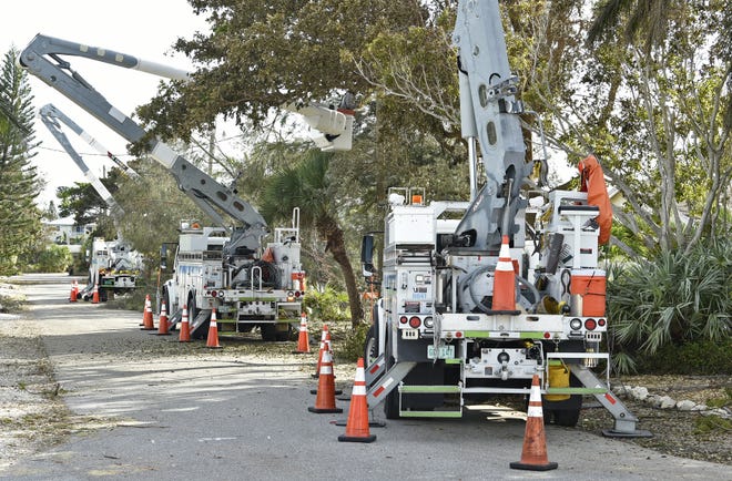 Florida Power and Light crews from the Whitfield Service Center repower the north end of Anna Maria Island on South Shore Drive after Hurricane Irma in 2017. [HERALD-TRIBUNE ARCHIVE / 2017 / THOMAS BENDER]