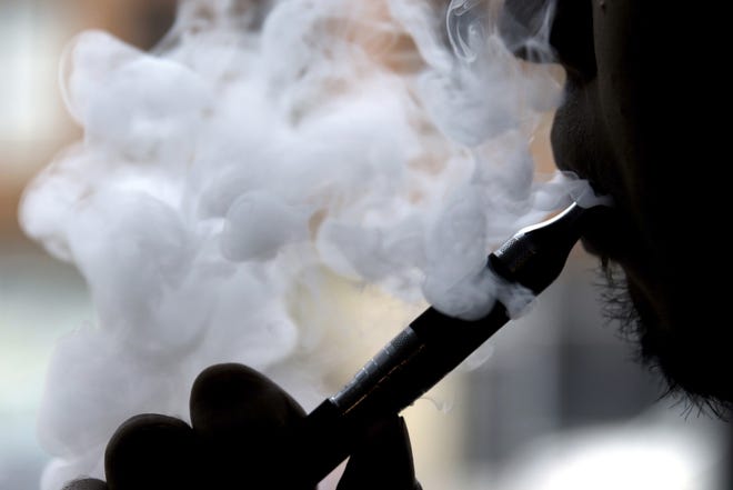 On Friday, the Centers for Disease Control and Prevention said they are investigating more cases of a breathing illness associated with vaping. The root cause remains unclear, but officials said Friday that many reports involve marijuana vaping. [AP Photo/Nam Y. Huh, File]