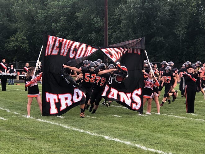 The Newcomerstown Trojans get ready to face Fairfield Christian Academy Friday night. (TimesReporter.com / Joe Wright)