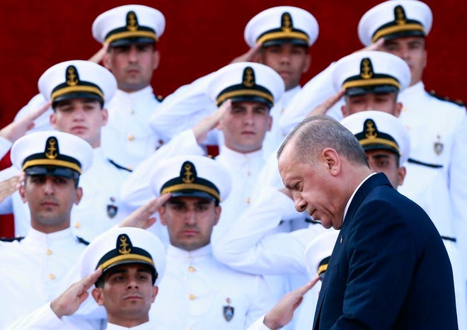 Turkey's President Recep Tayyip Erdogan, arrives to deliver a speech to graduates of a military academy in Istanbul, on Saturday. Erdogan said the U.S. had up to three weeks to satisfy Turkish demands and has threatened to launch a unilateral offensive into northeastern Syria if plans to establish a so-called safe zone along Turkey's border fail to meet his expectations. Earlier this month, Turkish and U.S. officials agreed to set up the zone east of the Euphrates River.