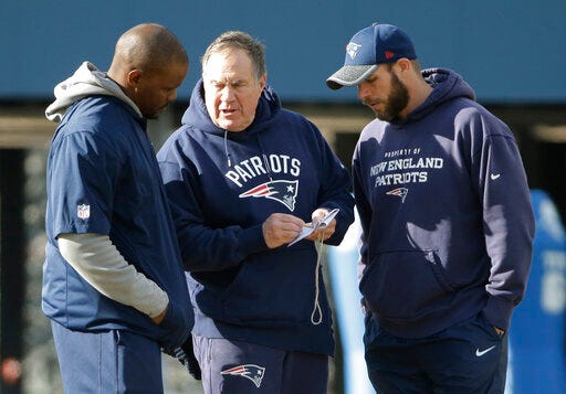 FILE - In this Jan. 19, 2017, file photo, New England Patriots head coach Bill Belichick, center, speaks with linebackers coach Brian Flores, left, and defensive line coach Brendan Daly during an NFL football team practice, in Foxborough, Mass. Flores is now the head coach of the Miami Dolphins. The Dolphins hired Flores even though the Patriots’ Way hasn’t worked elsewhere. While Belichick owns a record six Super Bowl championship rings, his former New England assistants have combined for one playoff victory as head coaches. (AP Photo/Steven Senne, File)