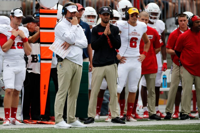 Florida Atlantic head coach Lane Kiffin, left, watches his team during the first half of an NCAA college football game against Ohio State, Saturday, Aug. 31, 2019, in Columbus, Ohio. (AP Photo/Jay LaPrete)