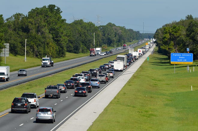 Traffic backs up along the northbound lanes of the Florida Turnpike in Lake and Sumter counties as south Florida residents fled ahead of Hurricane Irma Sept. 7, 2017. [Whitney Lehnecker / Daily Commercial]