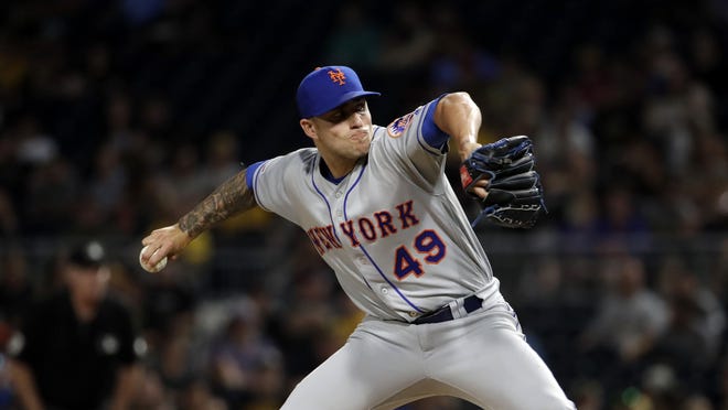 New York Mets relief pitcher Tyler Bashlor, a former Calvary Day School standout and a Springfield, Ga., native, delivers during a game against the Pirates in Pittsburgh on Aug. 2. [GENE J. PUSKAR/THE ASSOCIATED PRESS]