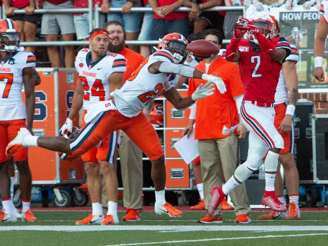 Syracuse's Adrian Cole bats away a pass intended for Liberty wide receiver Kevin Shaa during Saturday's game in Lynchburg, Virginia.    

[Matt Bell / Associated Press]