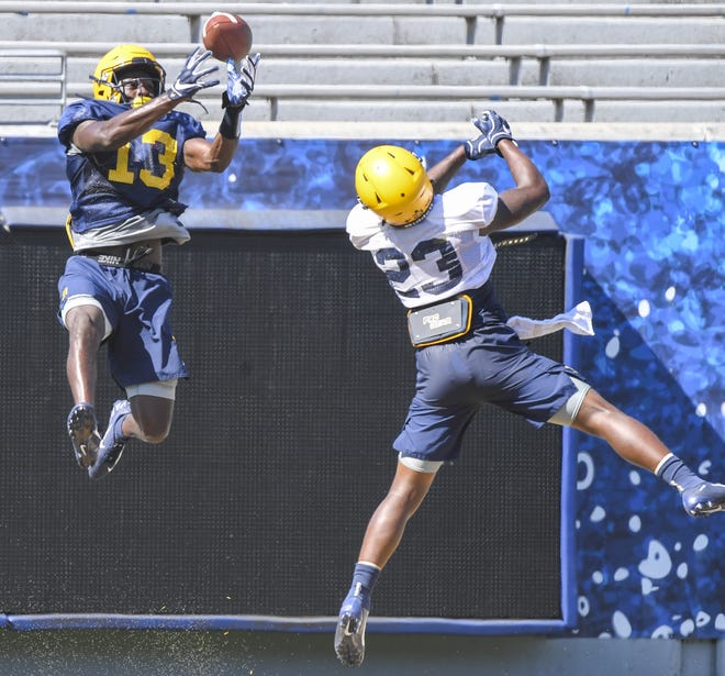 Sam James hauls down a pass in a recent scrimmage. [West Virginia University]