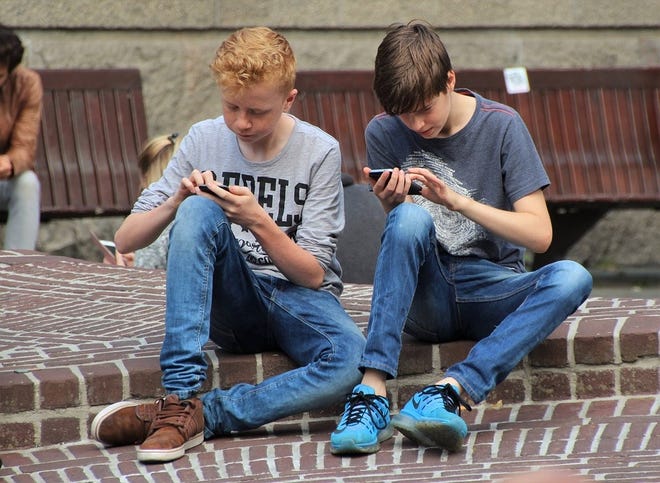 More school districts are going "phone-free" this school year, requiring students to lock up or turn off their cellphones during the school day to remove the electronic distraction, refocus attention on instruction and encourage social interaction. [Sentinel File]