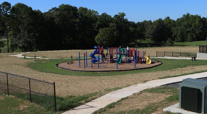 The area behind the existing playground is where a new proposed Sprayground at Dallas Park will be built. [Mike Hensdill/The Gaston Gazette]