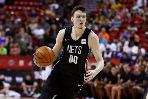FILE- In this July 14, 2019, file photo, Brooklyn Nets forward Rodions Kurucs plays against the Minnesota Timberwolves during an an NBA summer league basketball game in Las Vegas. Kurucs was arrested in New York on Tuesday, Sept. 3, 2019, for allegedly assaulting his former girlfriend inside his apartment. Police say the 32-year-old woman claims she had a verbal dispute with Kurucs in his apartment on June 27, when he struck and choked her. (AP Photo/John Locher, File)
