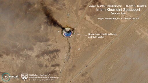 This satellite image from Planet Labs Inc., that has been annotated by experts at the James Martin Center for Nonproliferation Studies at Middlebury Institute of International Studies, shows a fire at a rocket launch pad at the Imam Khomeini Space Center in Iran's Semnan province, Thursday Aug. 29, 2019. The satellite image released Thursday shows the smoldering remains of a rocket at a Iran space center that was to conduct a U.S.-criticized satellite launch. (Planet Labs Inc, Middlebury Institute of International Studies via AP)