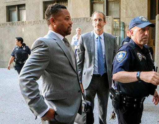 Cuba Gooding, Jr., left, arrives at court to face a groping allegation charge, Tuesday Sept. 3, 2019, in New York. (AP Photo/Bebeto Matthews)