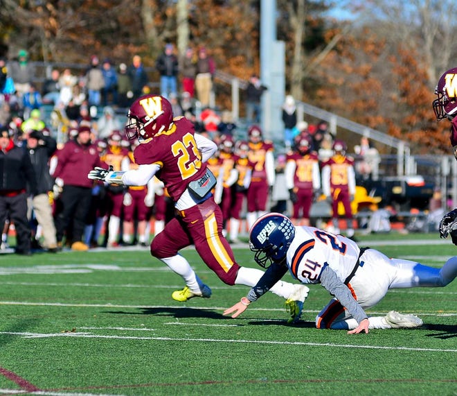 Weymouth's Seth Mullen breaks a tackle on his way to scoring during the first half of the Thanksgiving Day game against Walpole on Nov. 22, 2018. [Wicked Local Photo/Mike Borden]