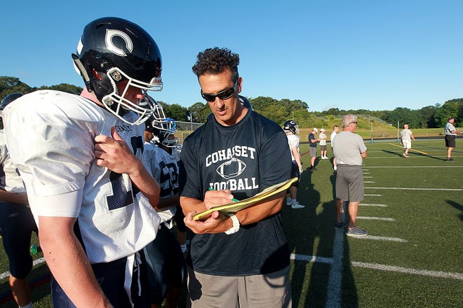 Head coach Pete Afanasiw goes over a play with quarterback Tucker Fulton during their scrimmage with Hanover at the high school football jamboree at Duxbury High on Saturday, Aug. 24, 2019. [Wicked Local Staff Photo/ Robin Chan]